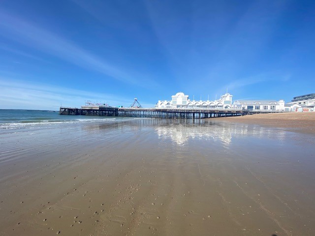 ...south parade pier reflected on to wet sand